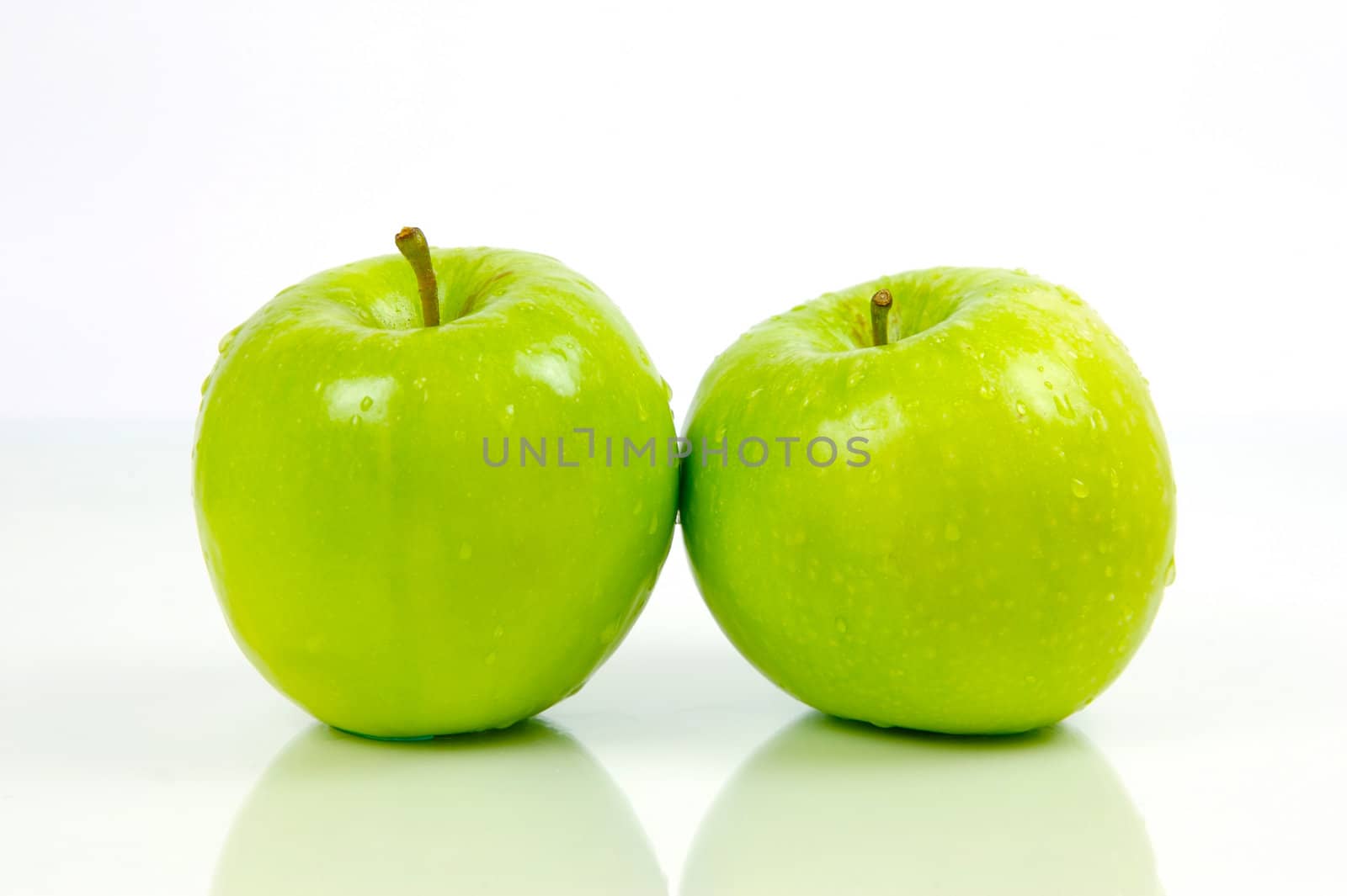 Green apples isolated against a white background