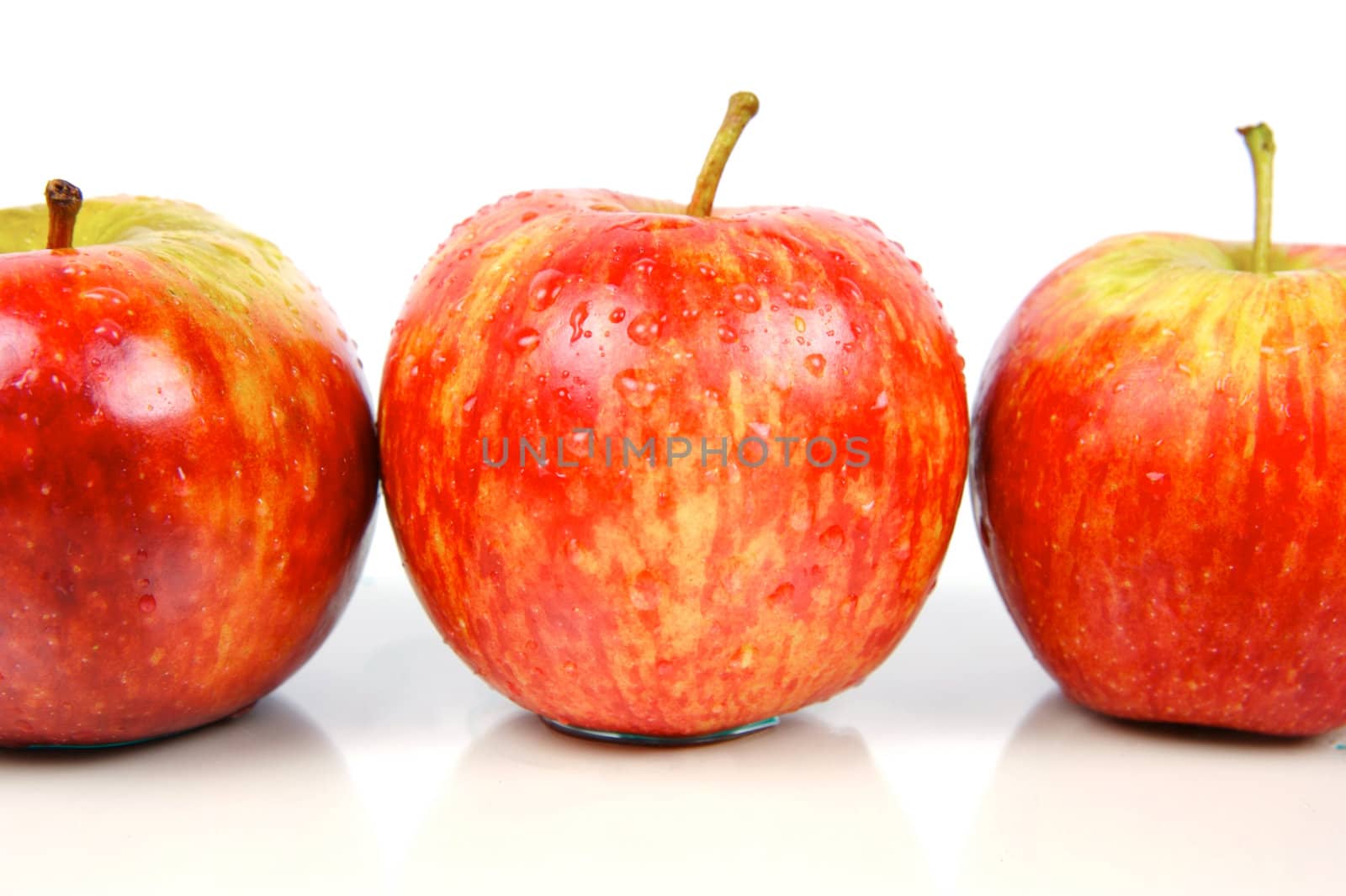 Red apples isolated against a white background