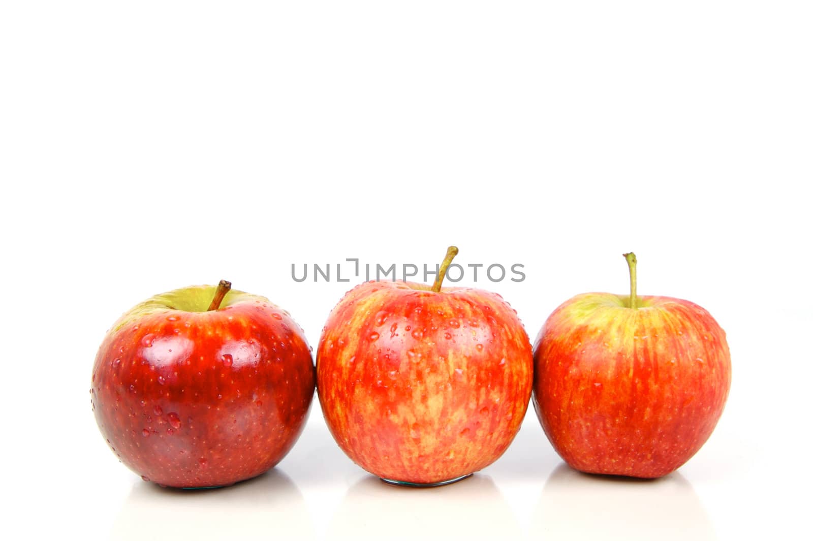 Red apples isolated against a white background