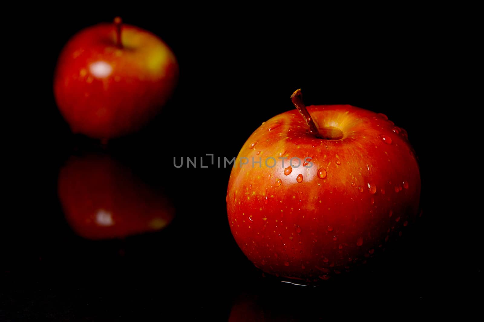 Red Apples isolated against a black background