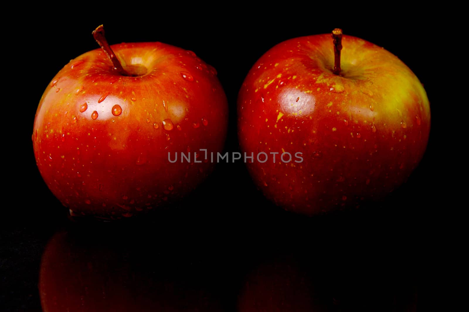 Red Apples isolated against a black background