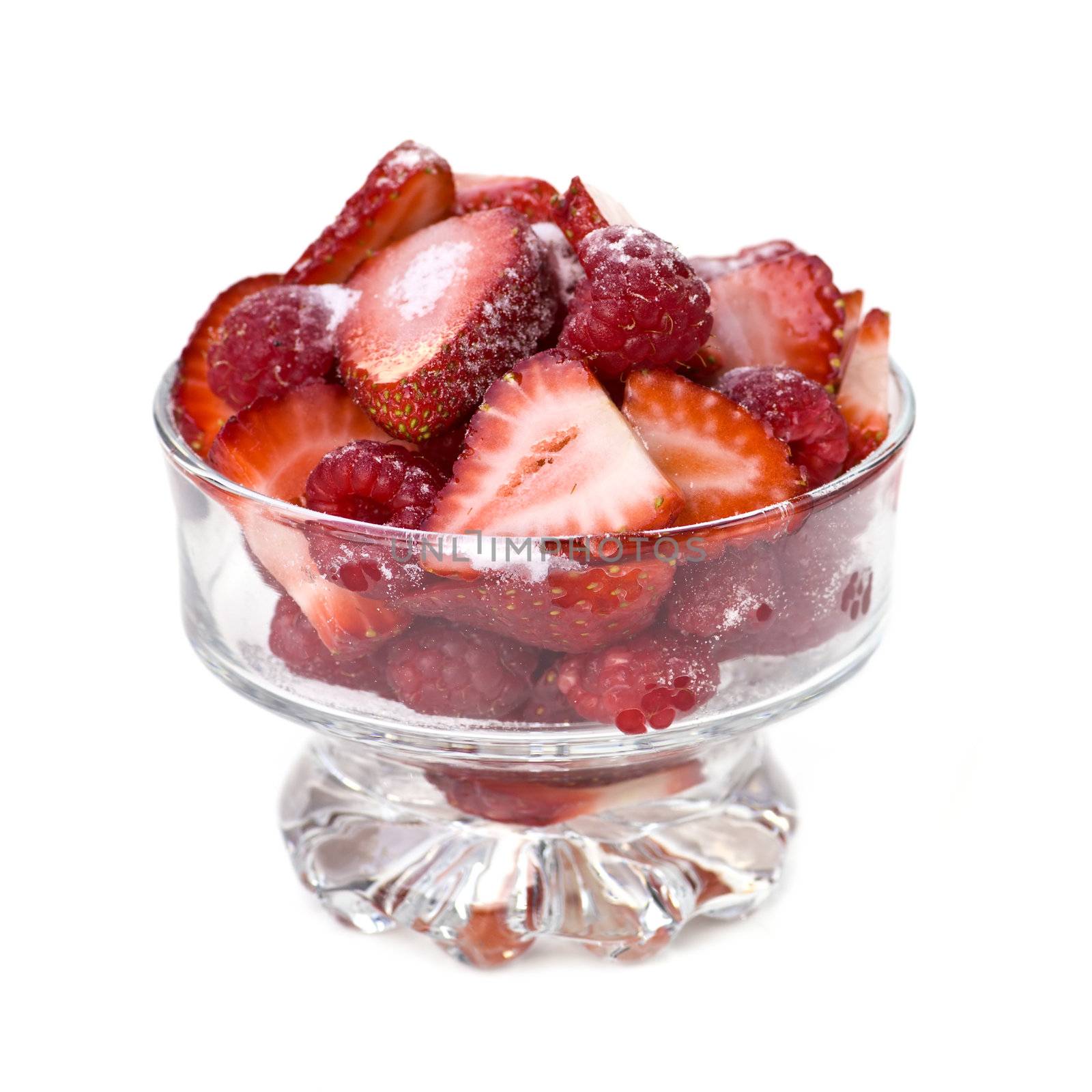 Fresh raspberries and strawberries in dish by elenathewise