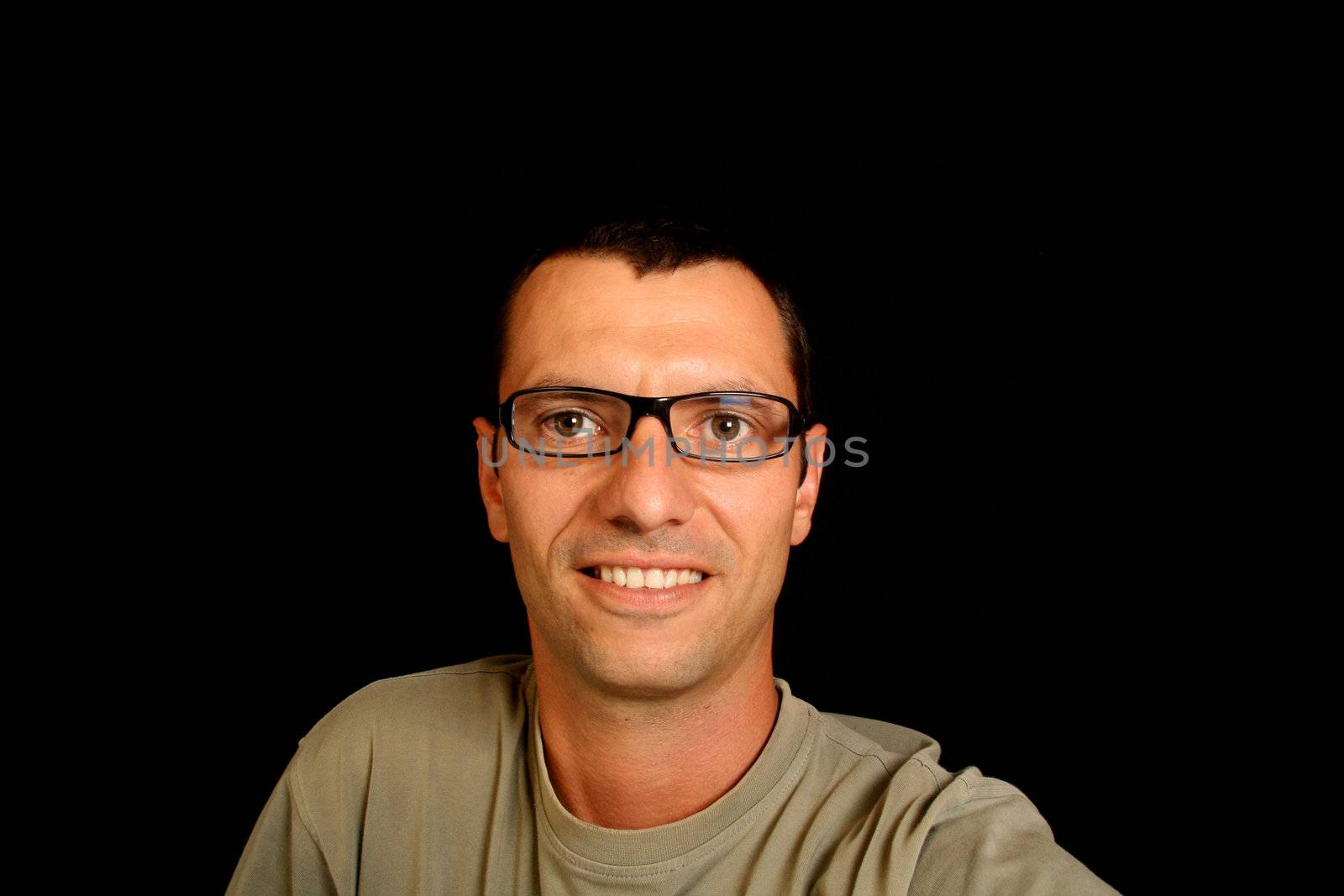 young man over black background