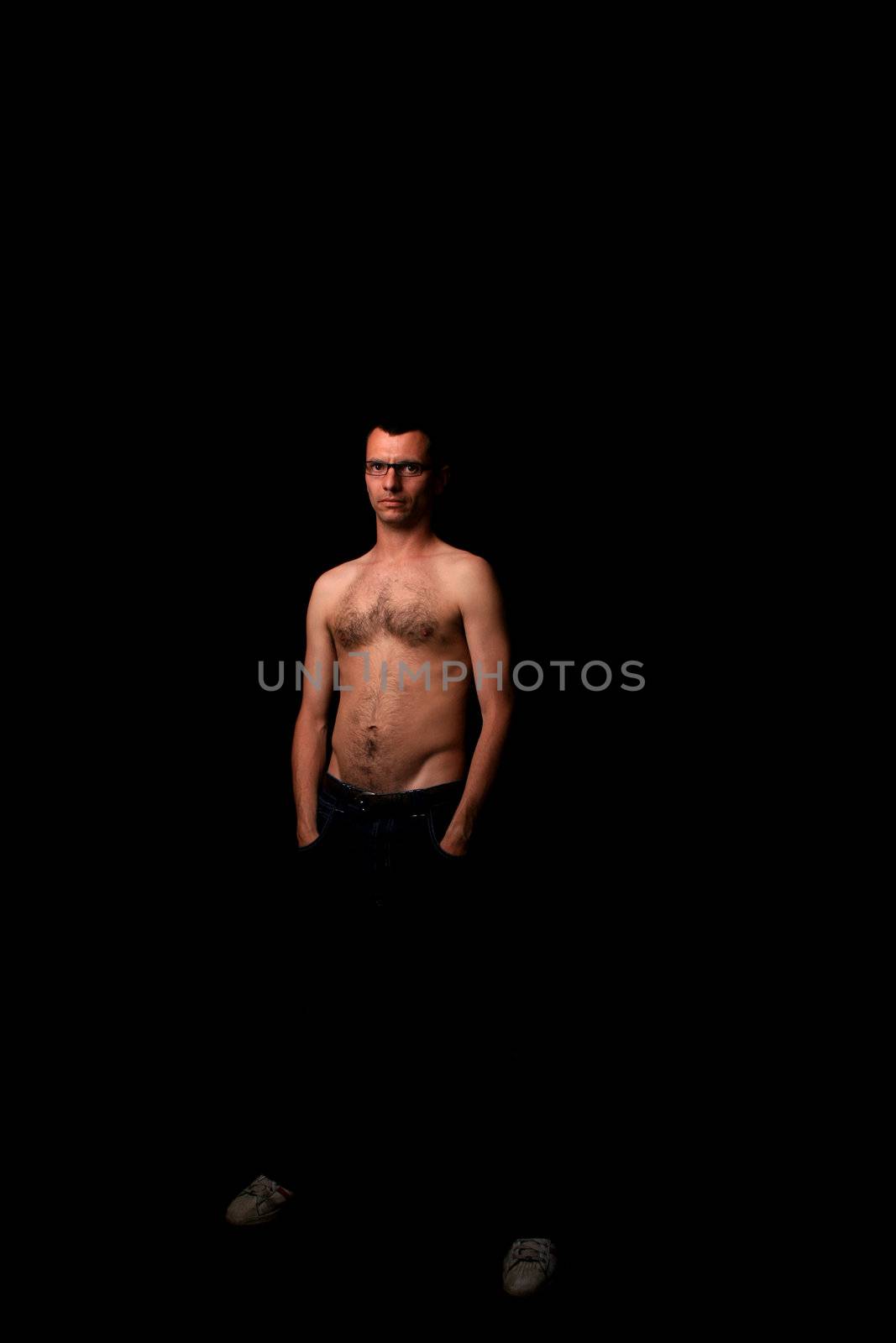 young man over black background