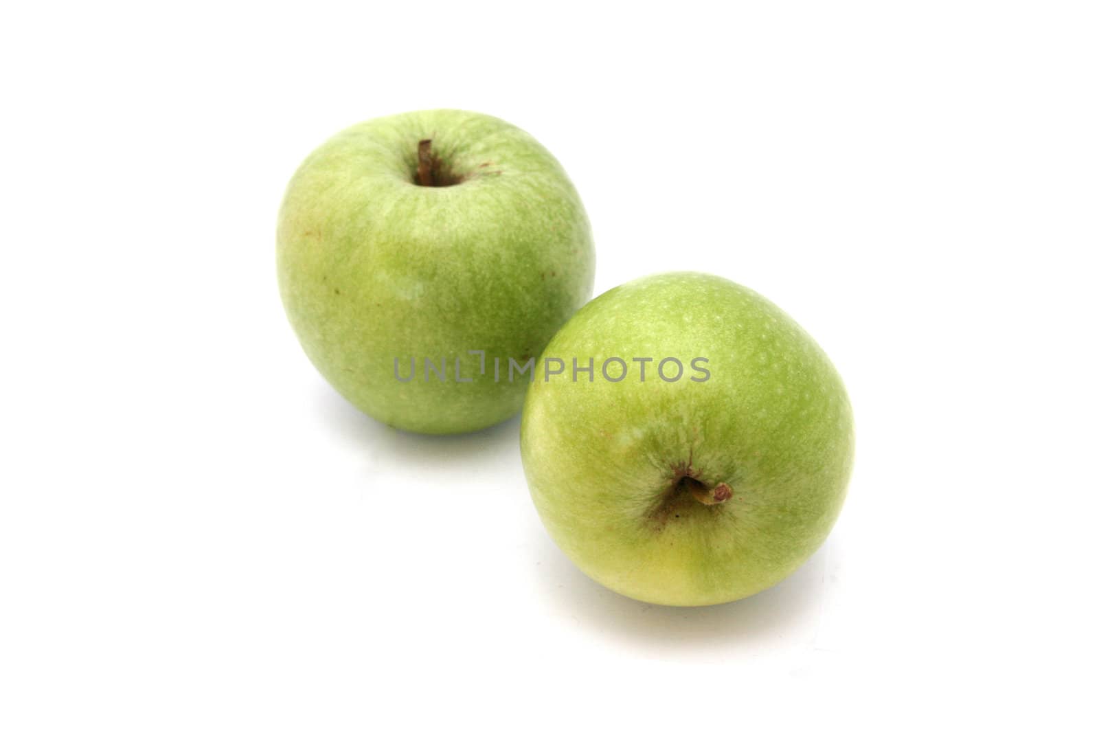 green apples over white background