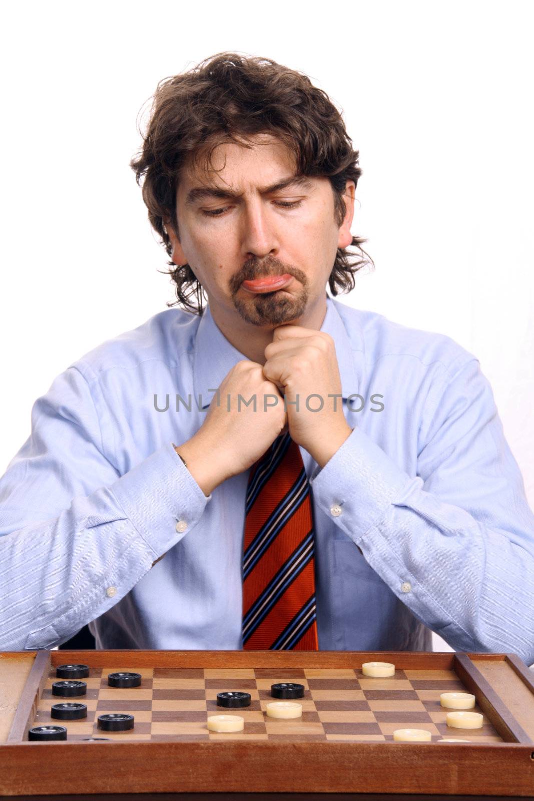 businessman playing chess over white background