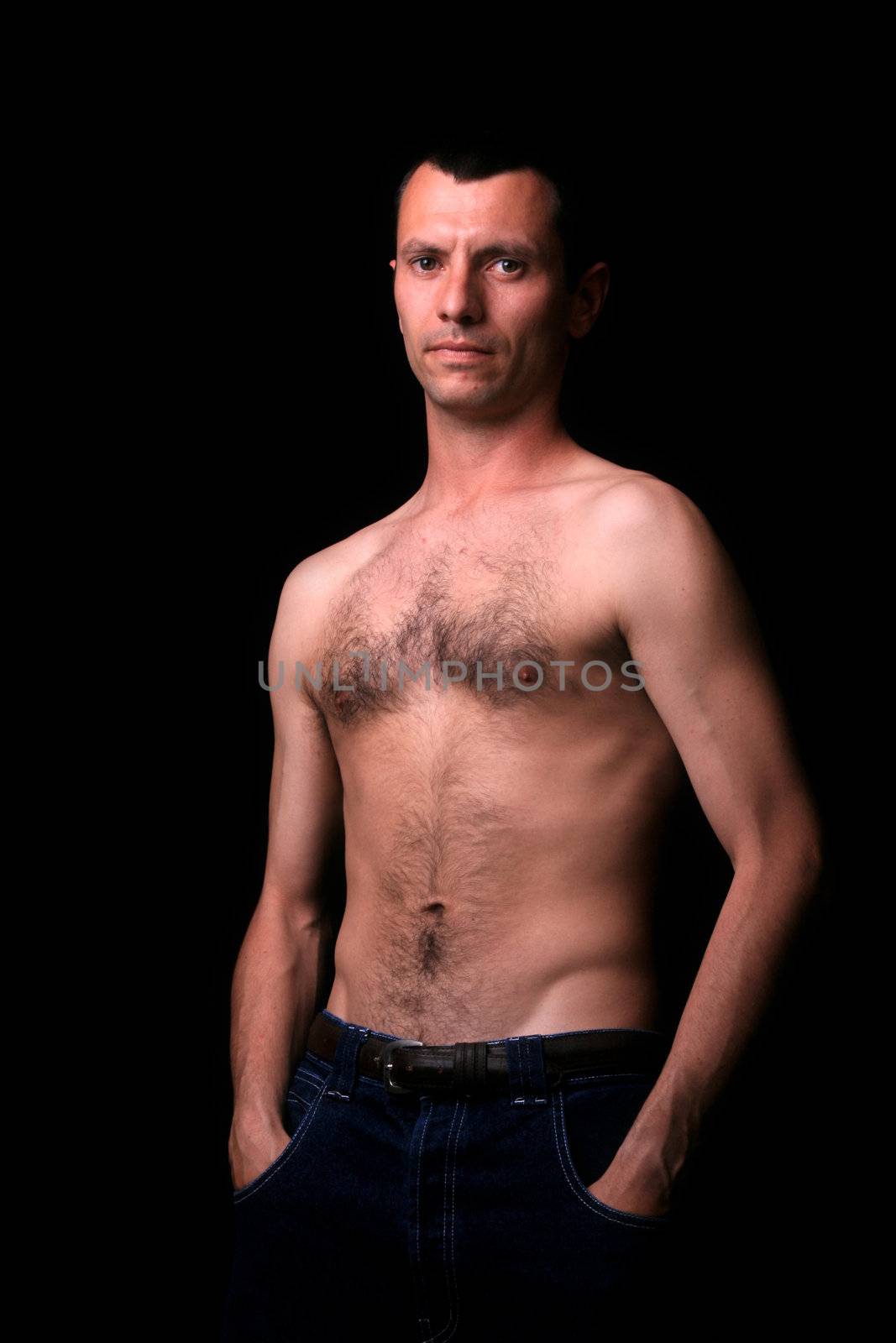 young man over black background