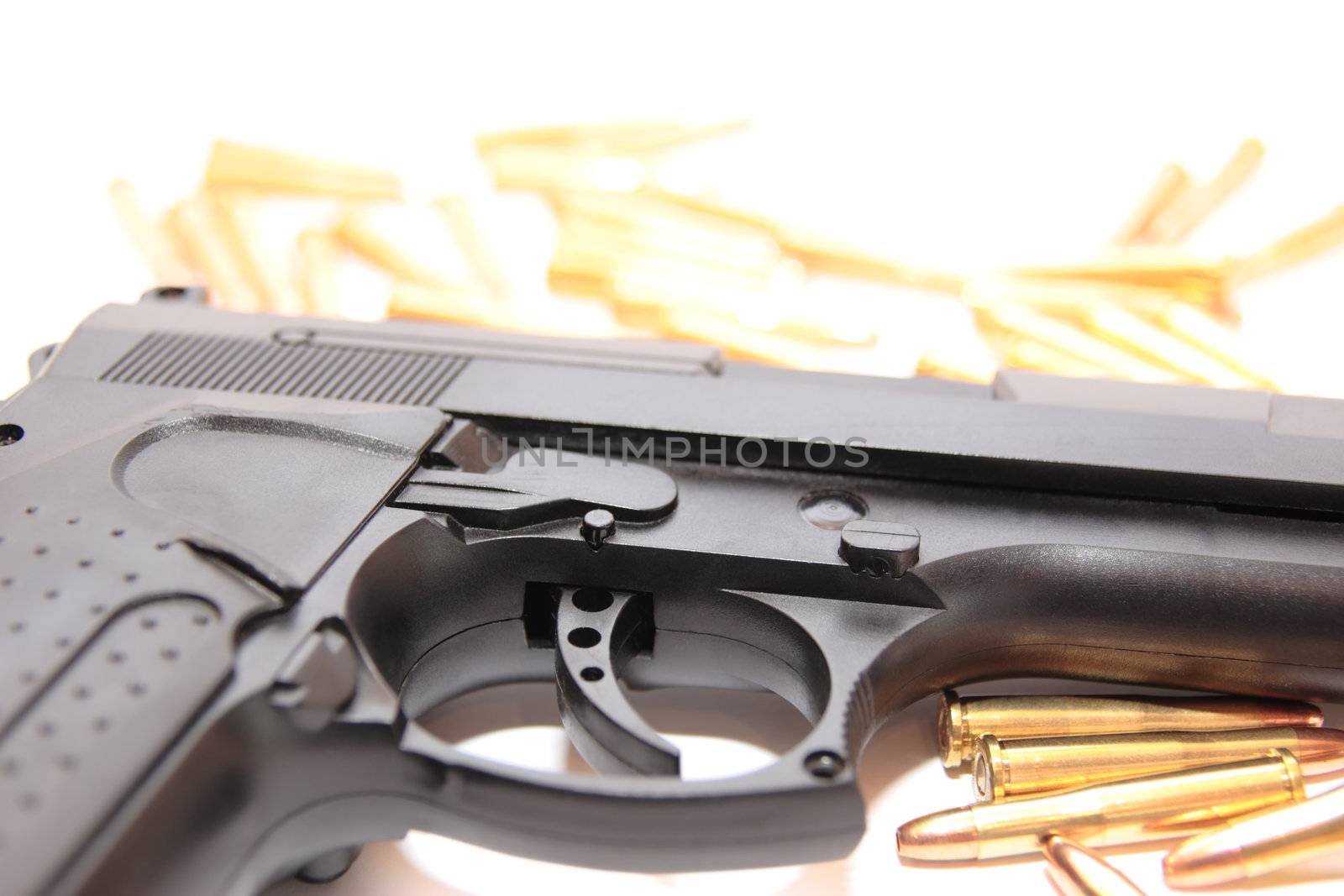gold ammo and a handgun depicting gun culture