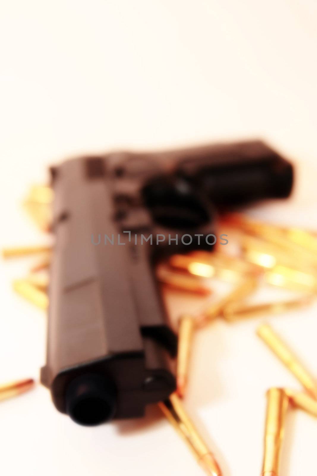 gold ammo and a handgun depicting gun culture