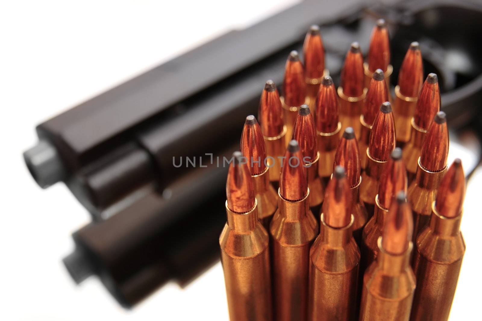gold ammo and a handgun depicting gun culture