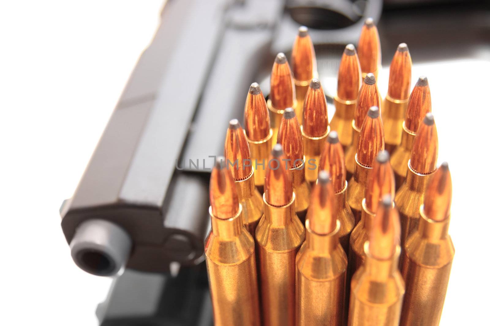 gold ammo and a handgun depicting gun culture