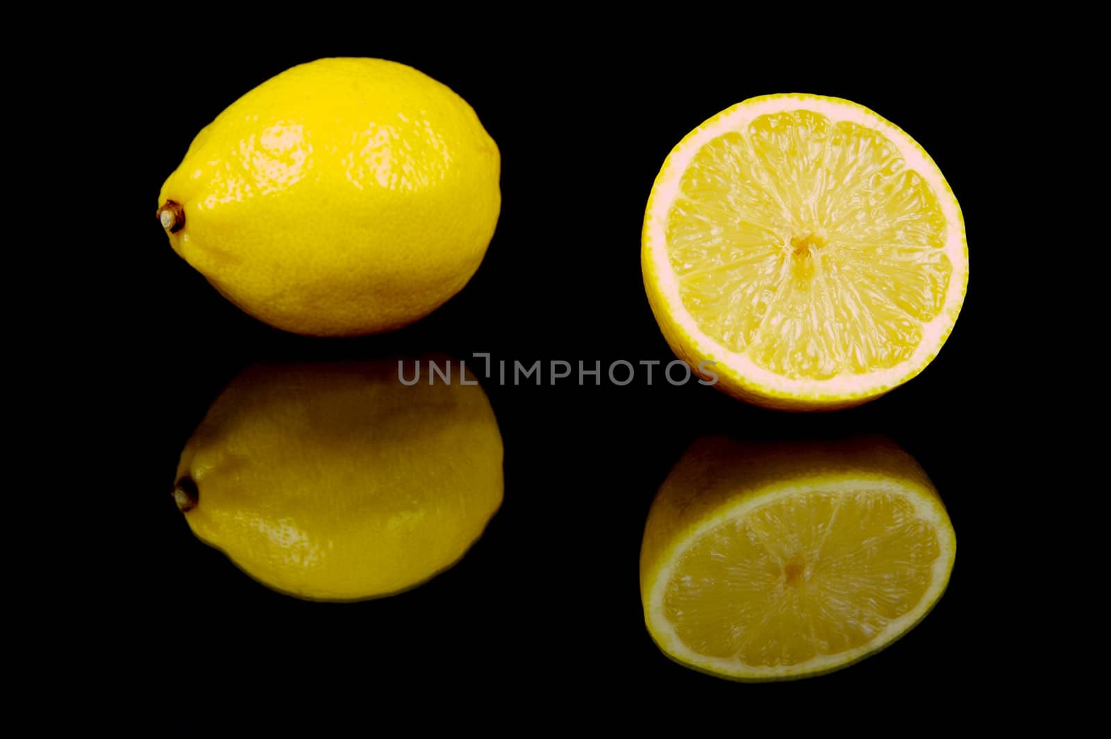 Lemon citrus fruits isolated against a black background