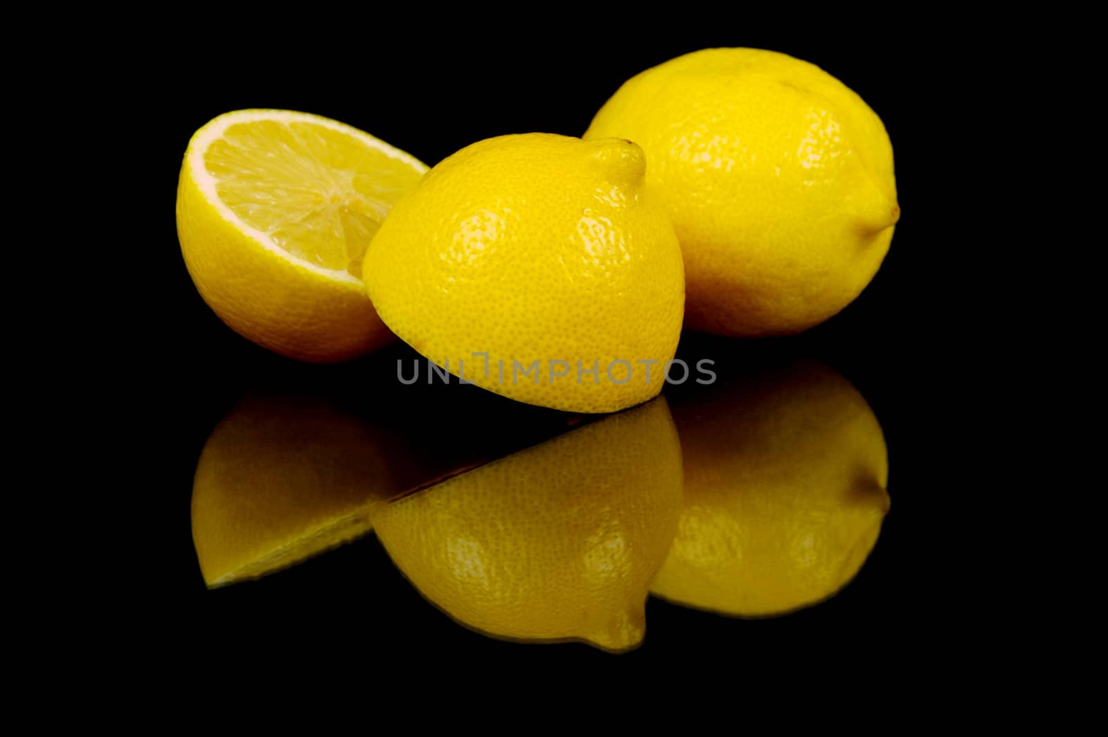 Lemon citrus fruits isolated against a black background