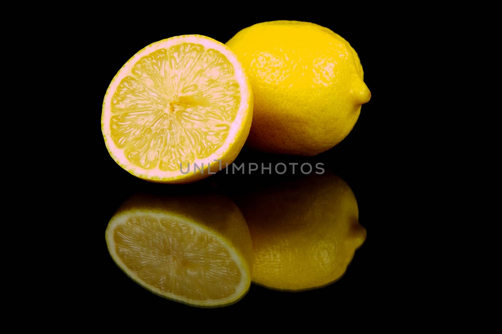 Lemon citrus fruits isolated against a black background