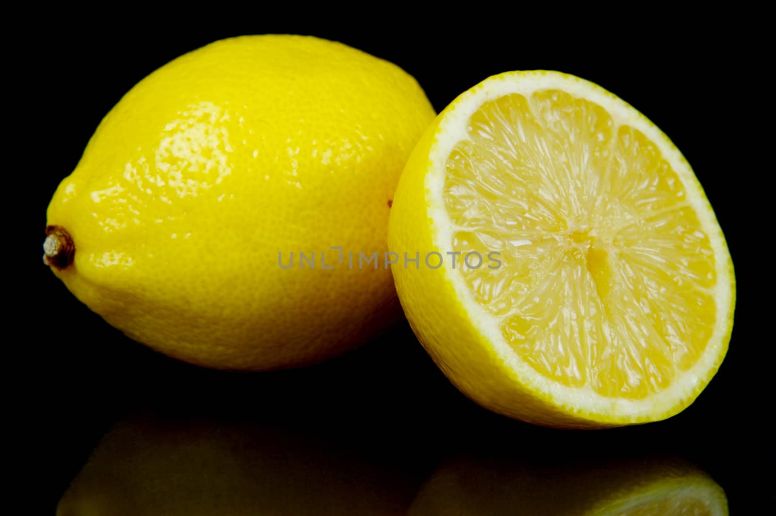 Lemon citrus fruits isolated against a black background