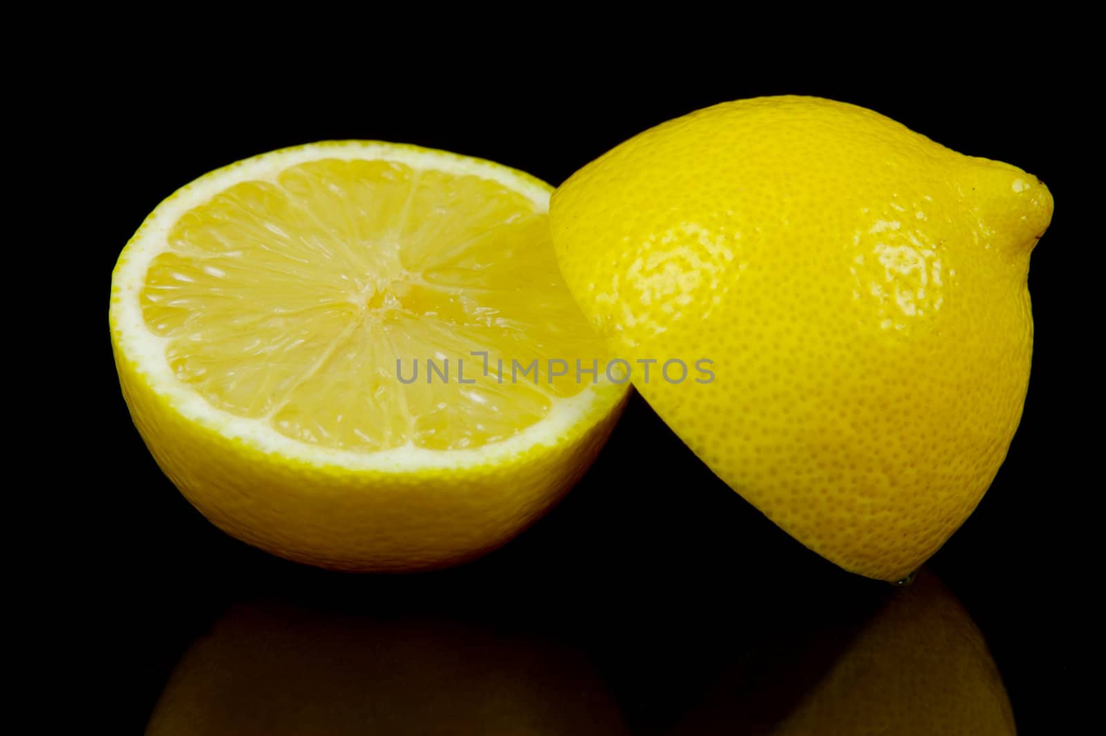 Lemon citrus fruits isolated against a black background