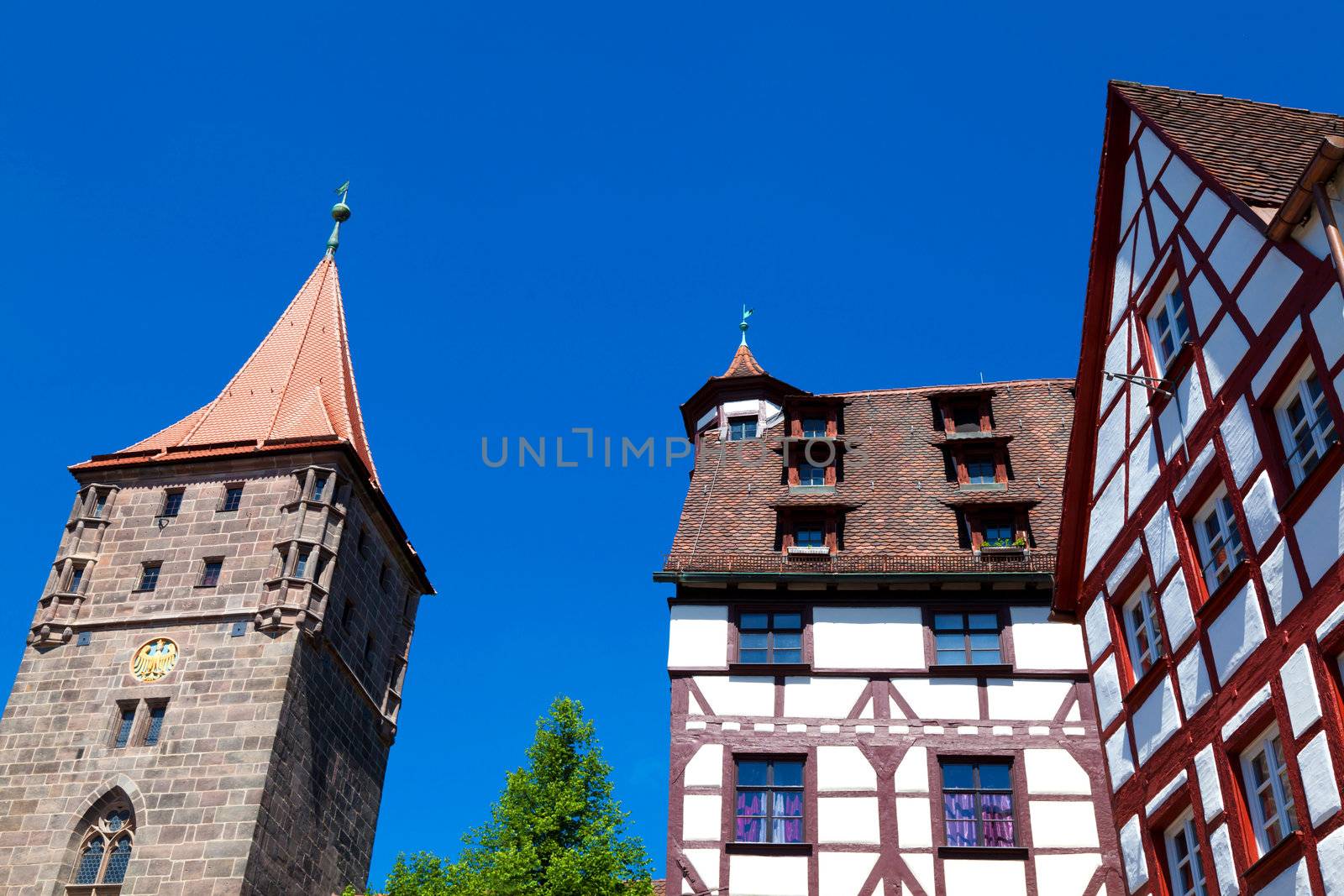Half-timbered houses and tower of the Nuremberg castle (Nürnberg, Germany)