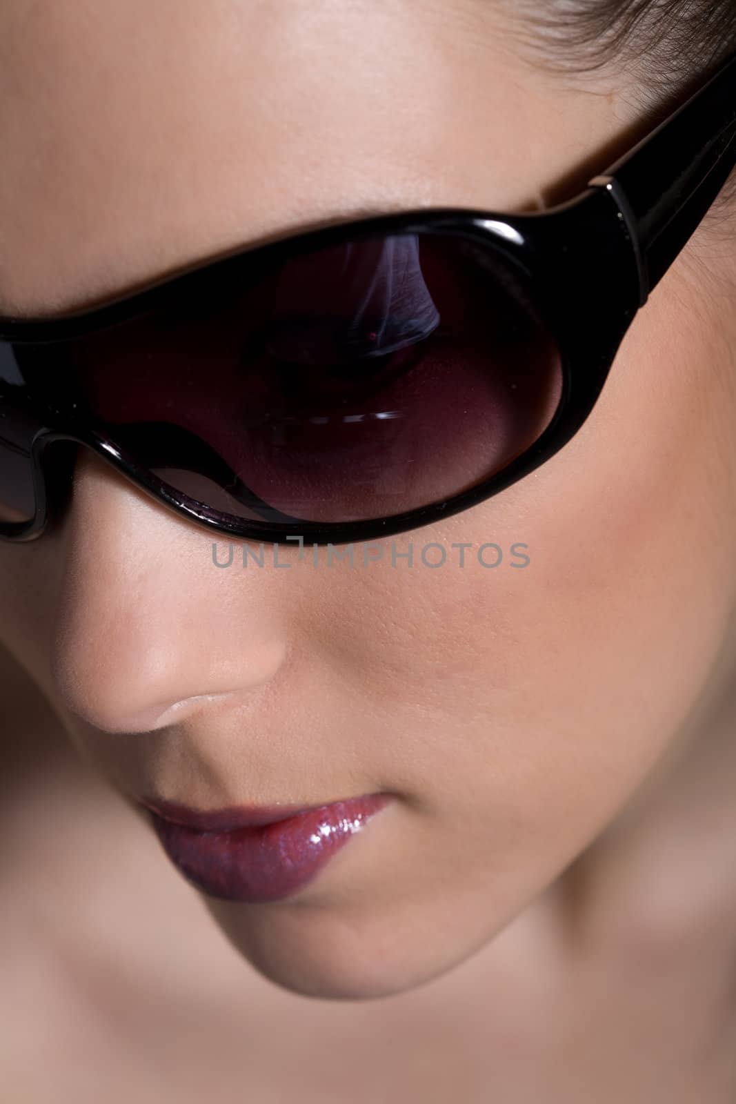 Beauty closeup of woman face with sunglasses
