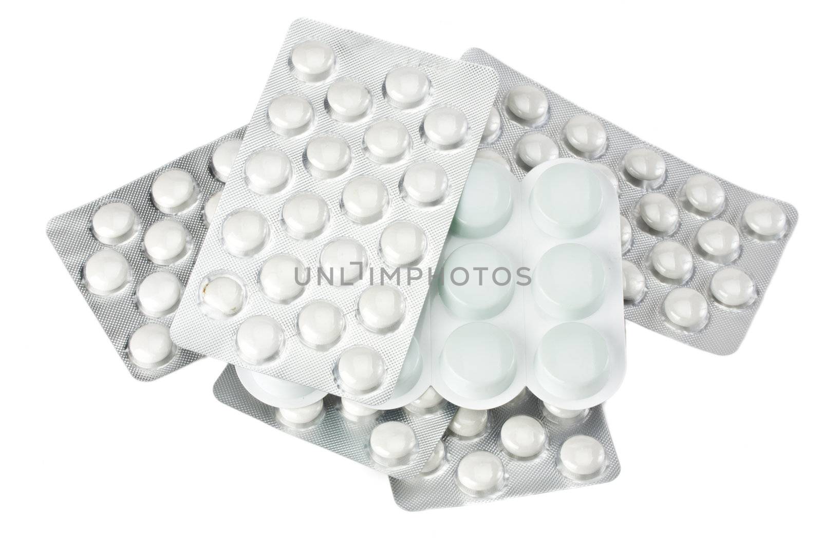 white pills in blister package isolated by bernjuer
