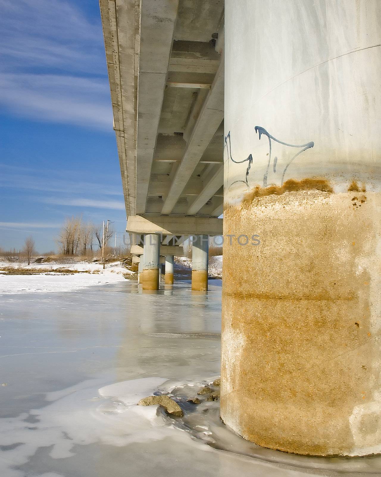 close-up shot of a concrete rusty bridge