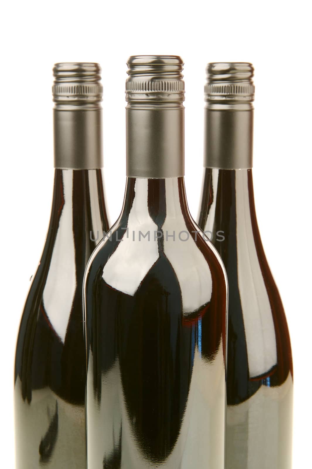 Bottles of red wine isolated against a white background