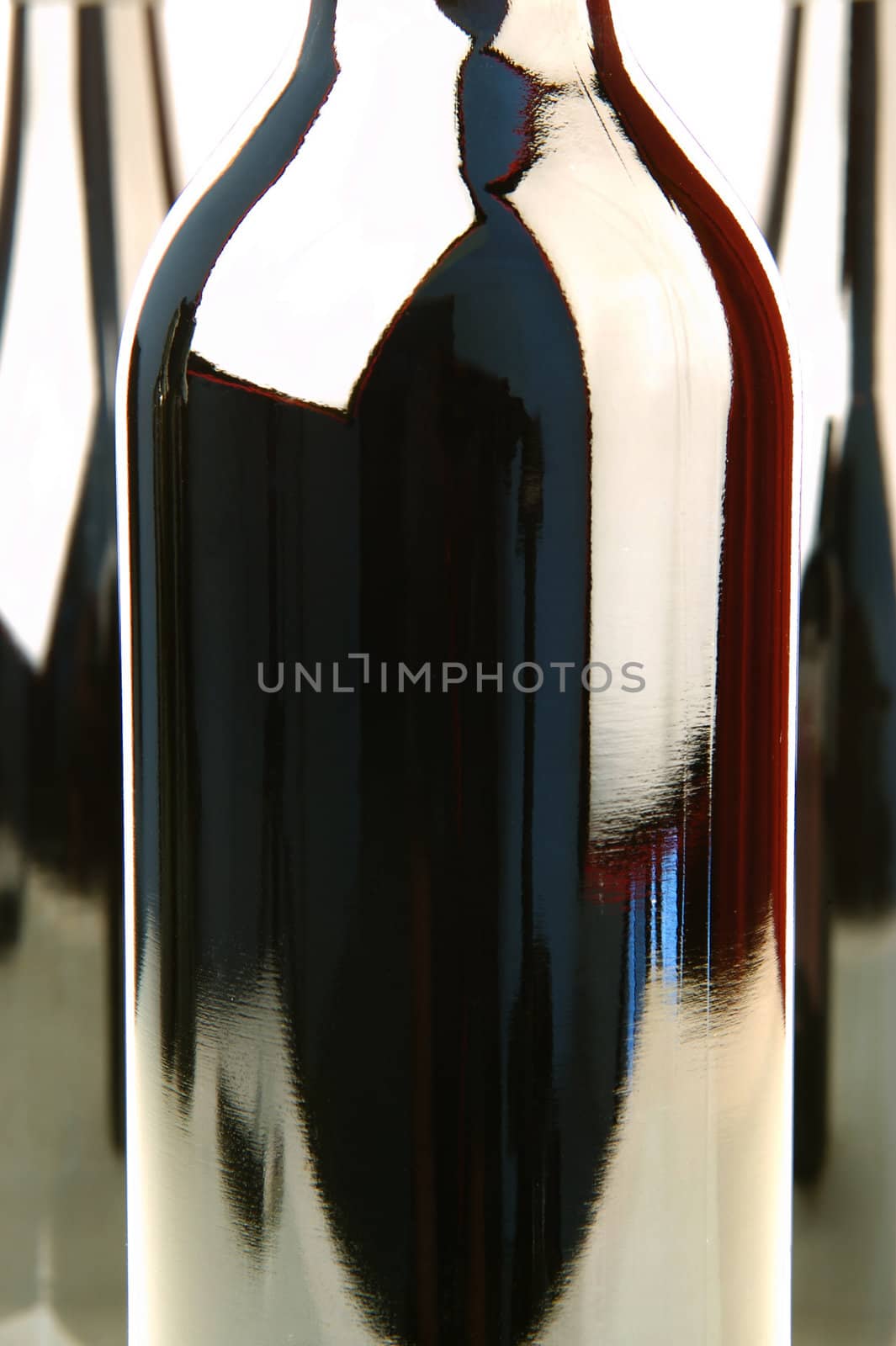 Bottles of red wine isolated against a white background