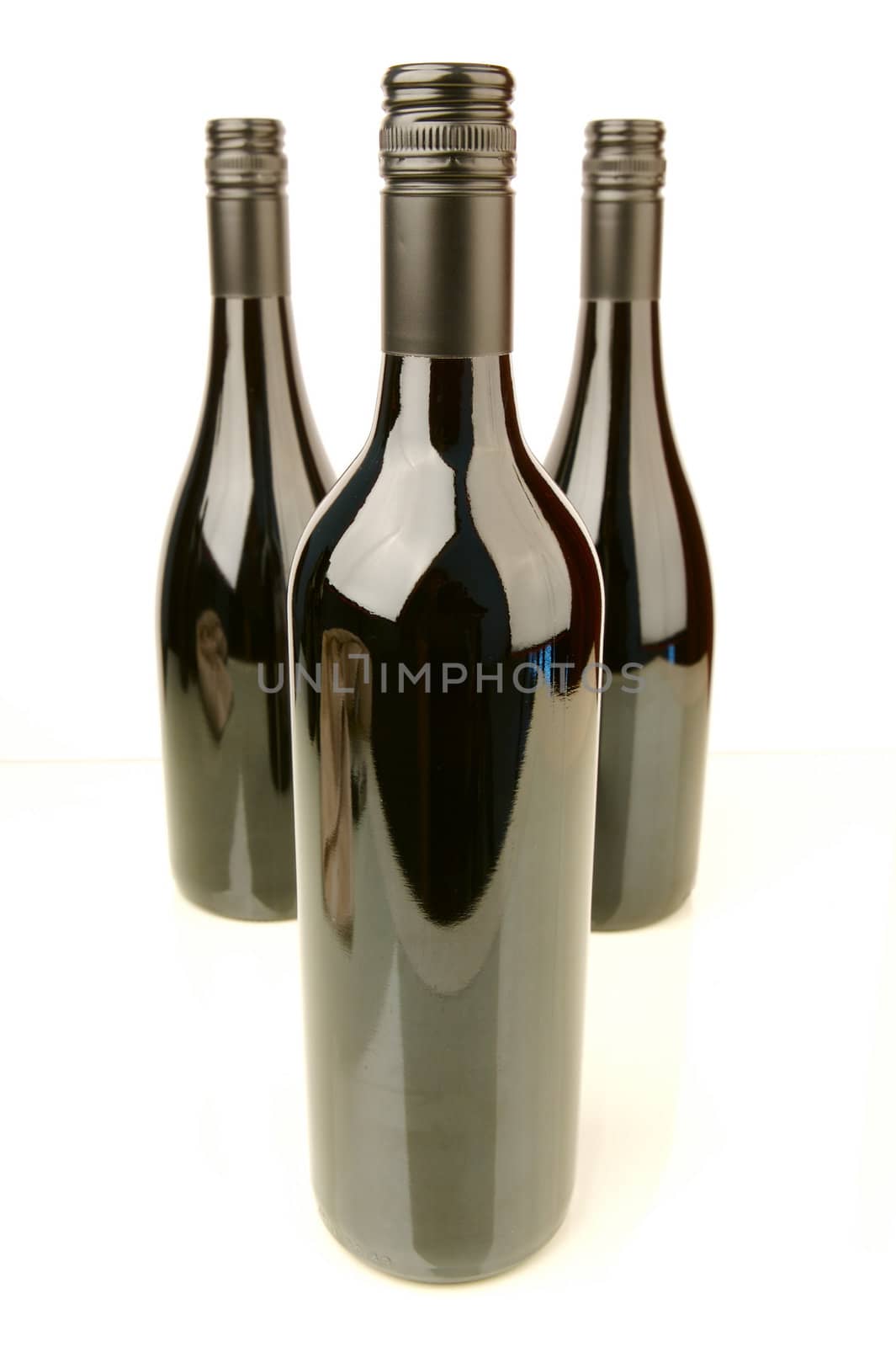 Bottles of red wine isolated against a white background