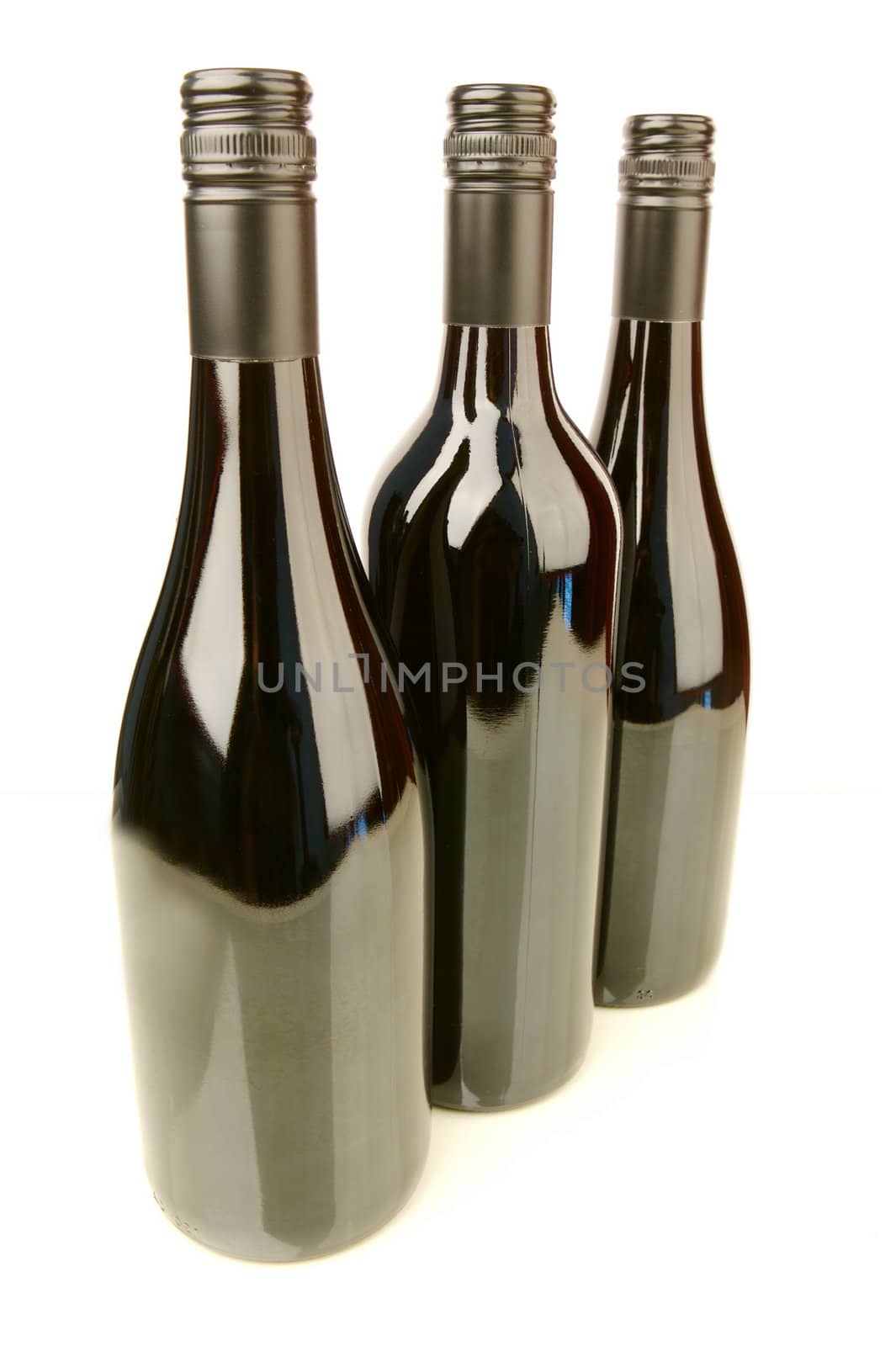 Bottles of red wine isolated against a white background
