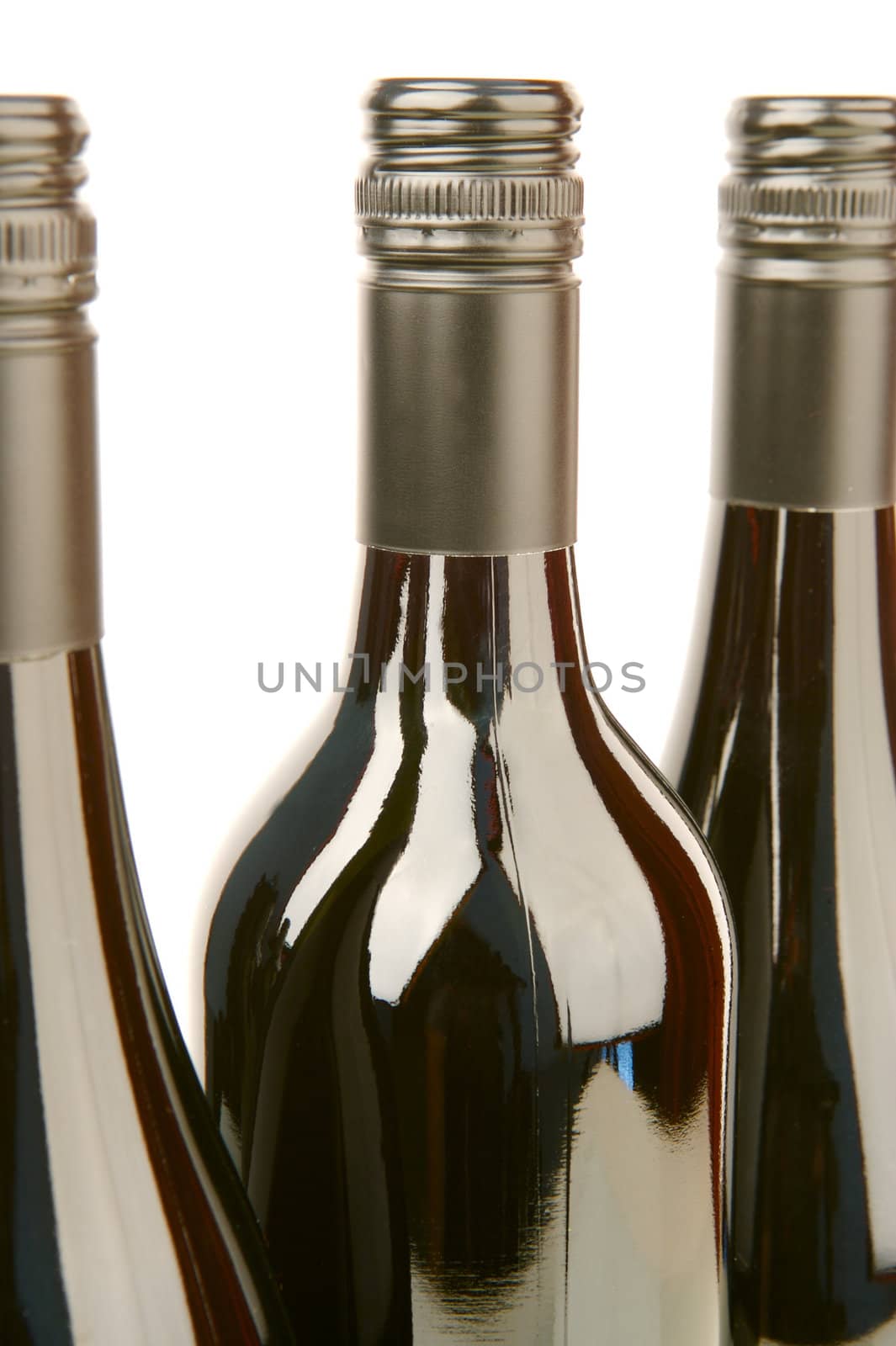 Bottles of red wine isolated against a white background