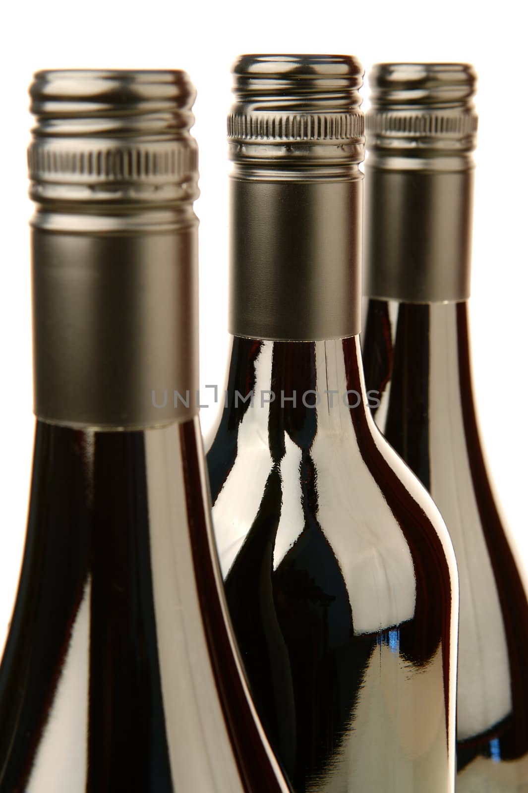 Bottles of red wine isolated against a white background