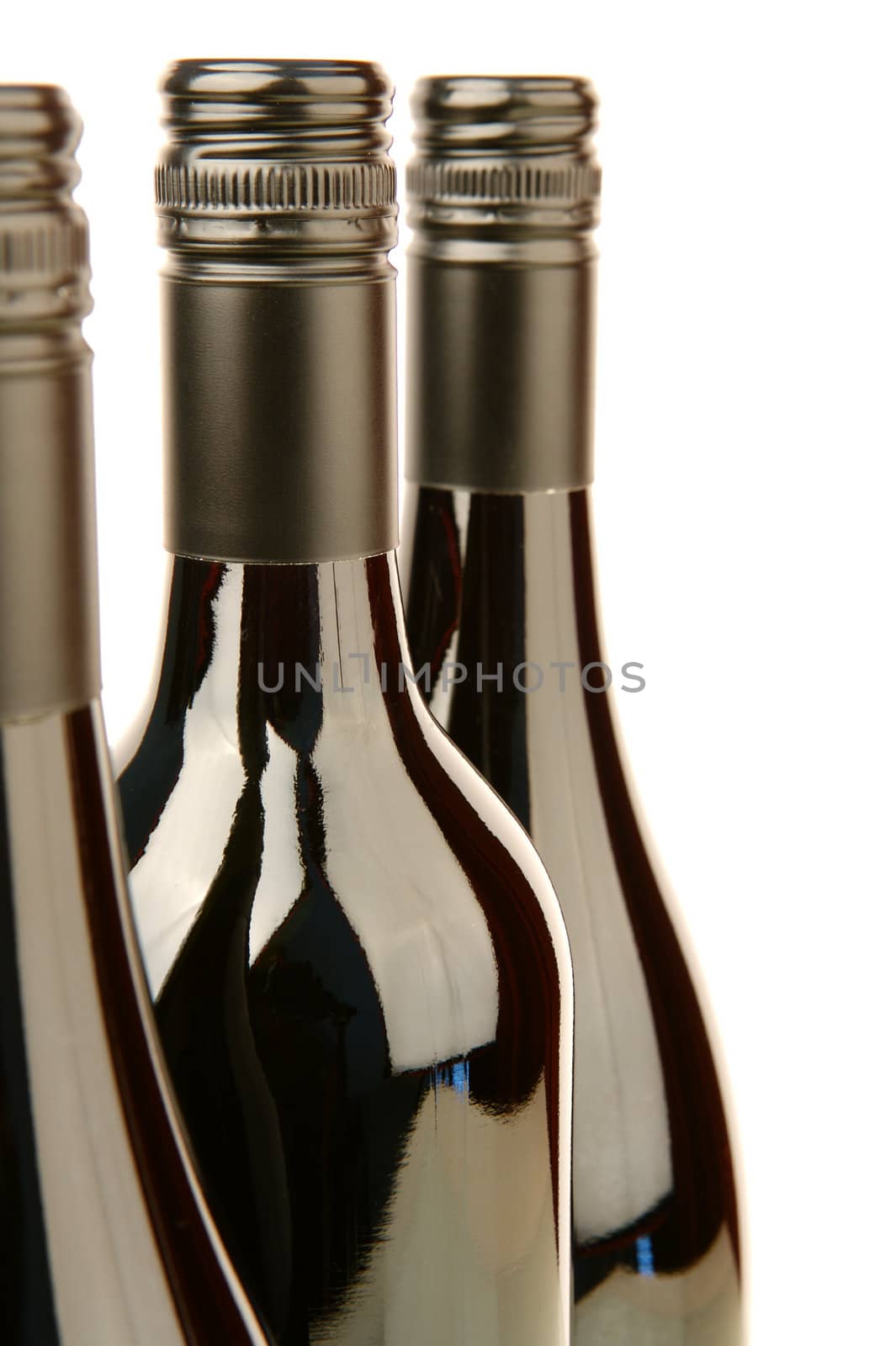Bottles of red wine isolated against a white background