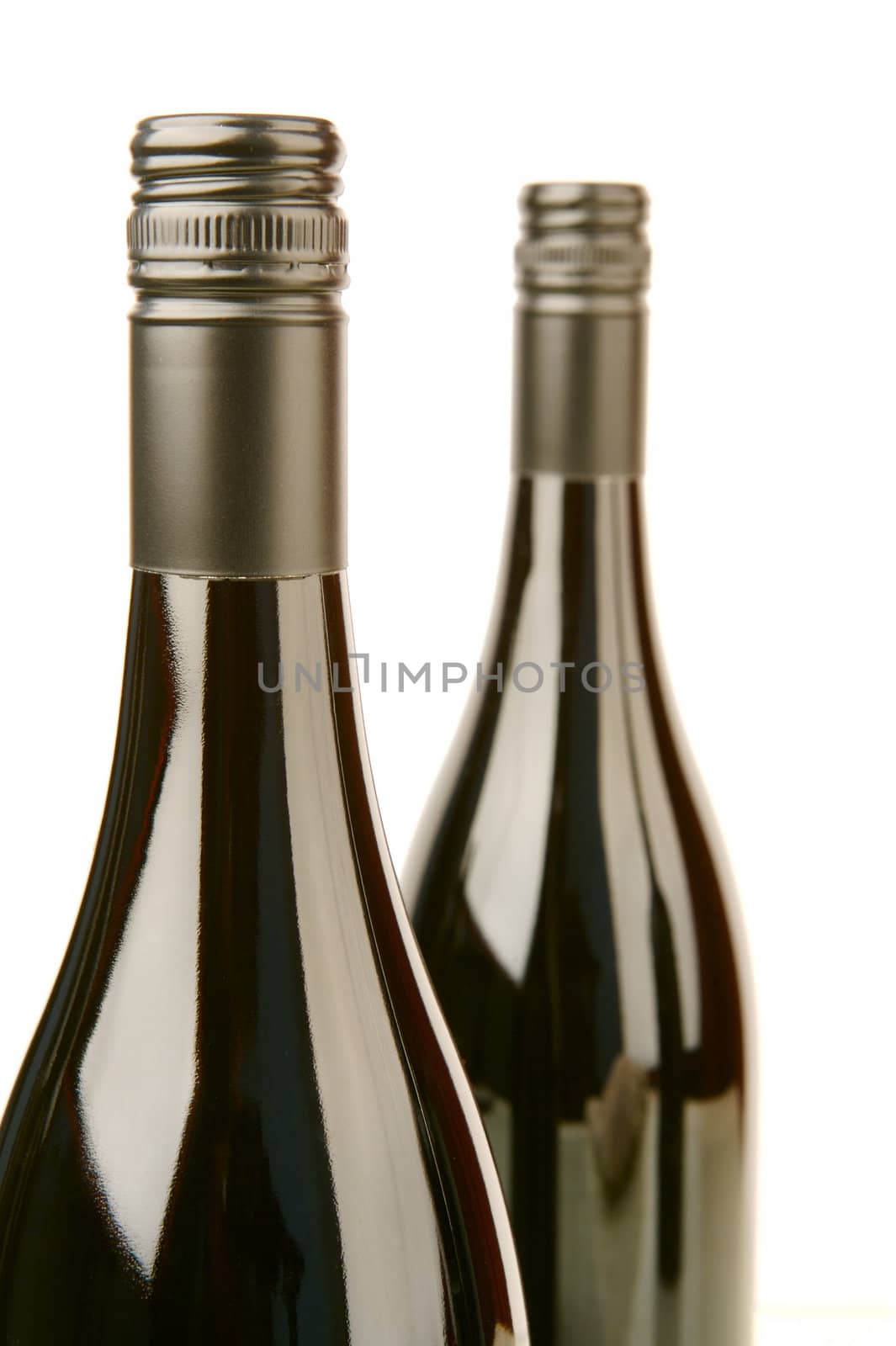 Bottles of red wine isolated against a white background