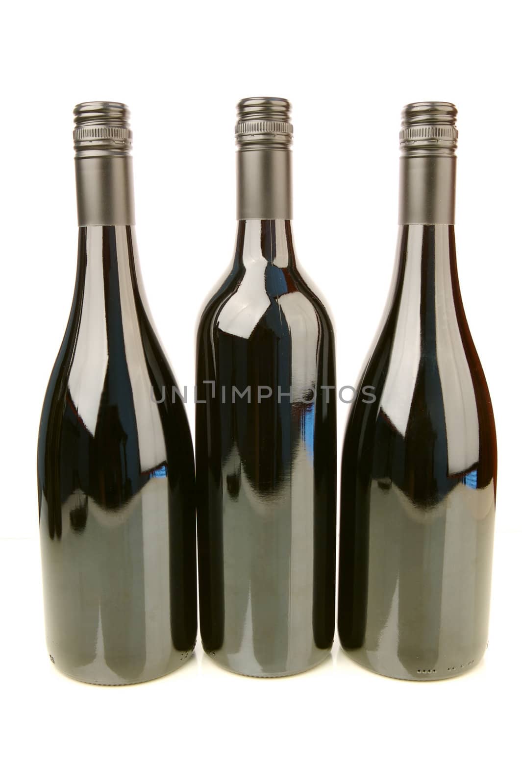 Bottles of red wine isolated against a white background