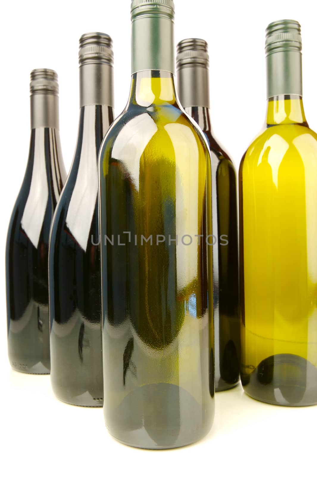 Bottles of red and white wine isolated against a white background