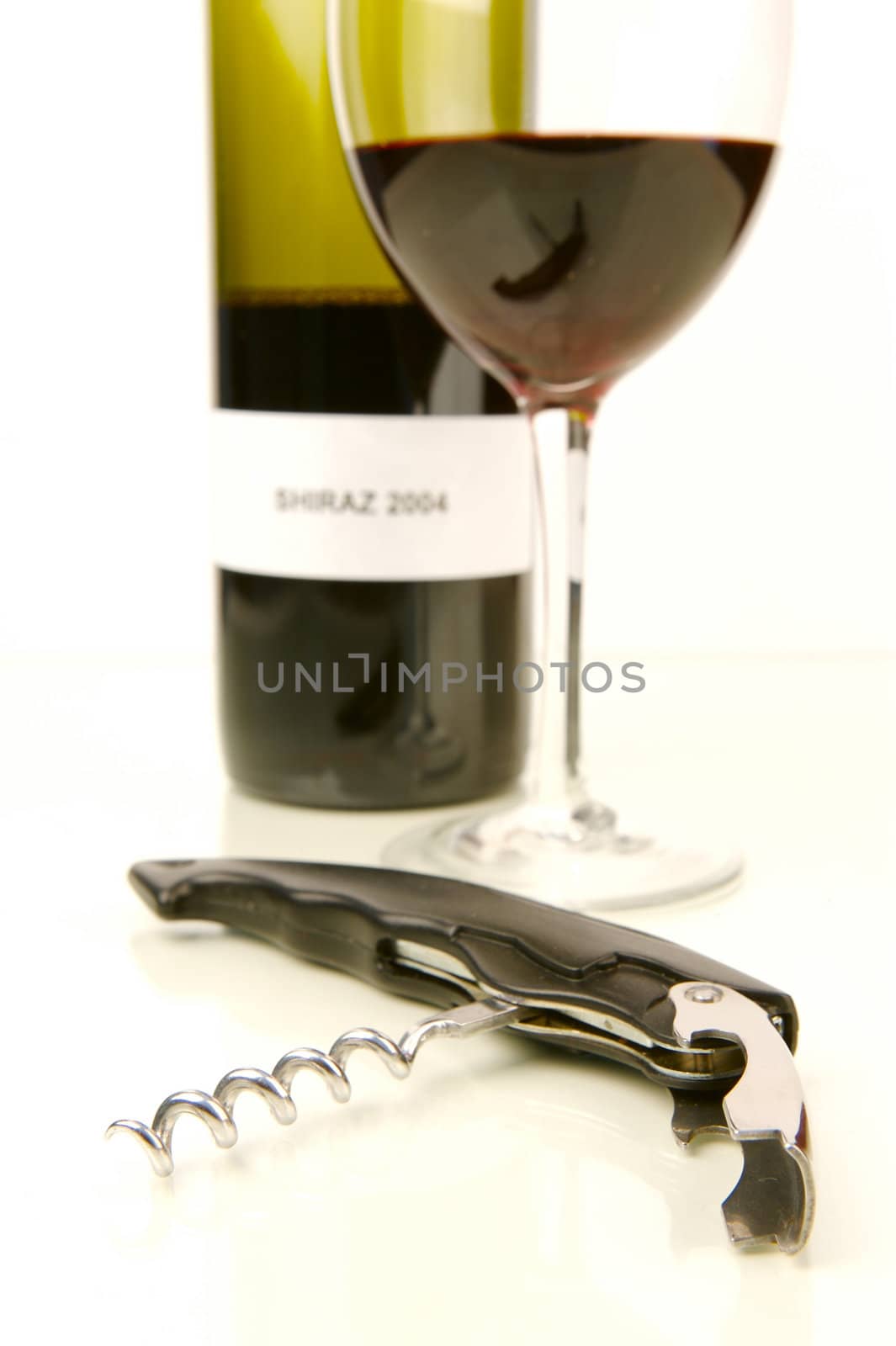Red and white wine isolated against a white background