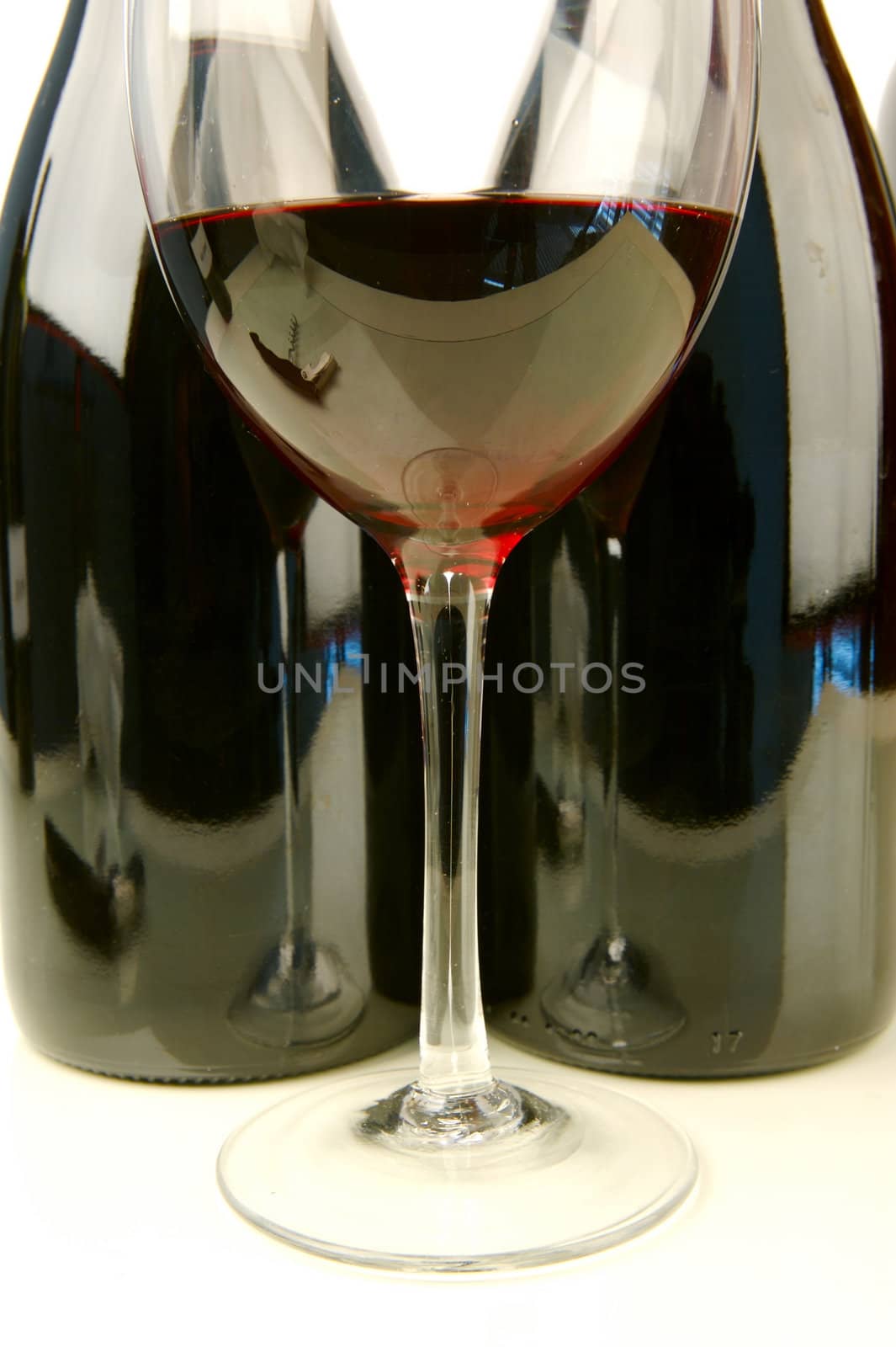 Red and white wine isolated against a white background