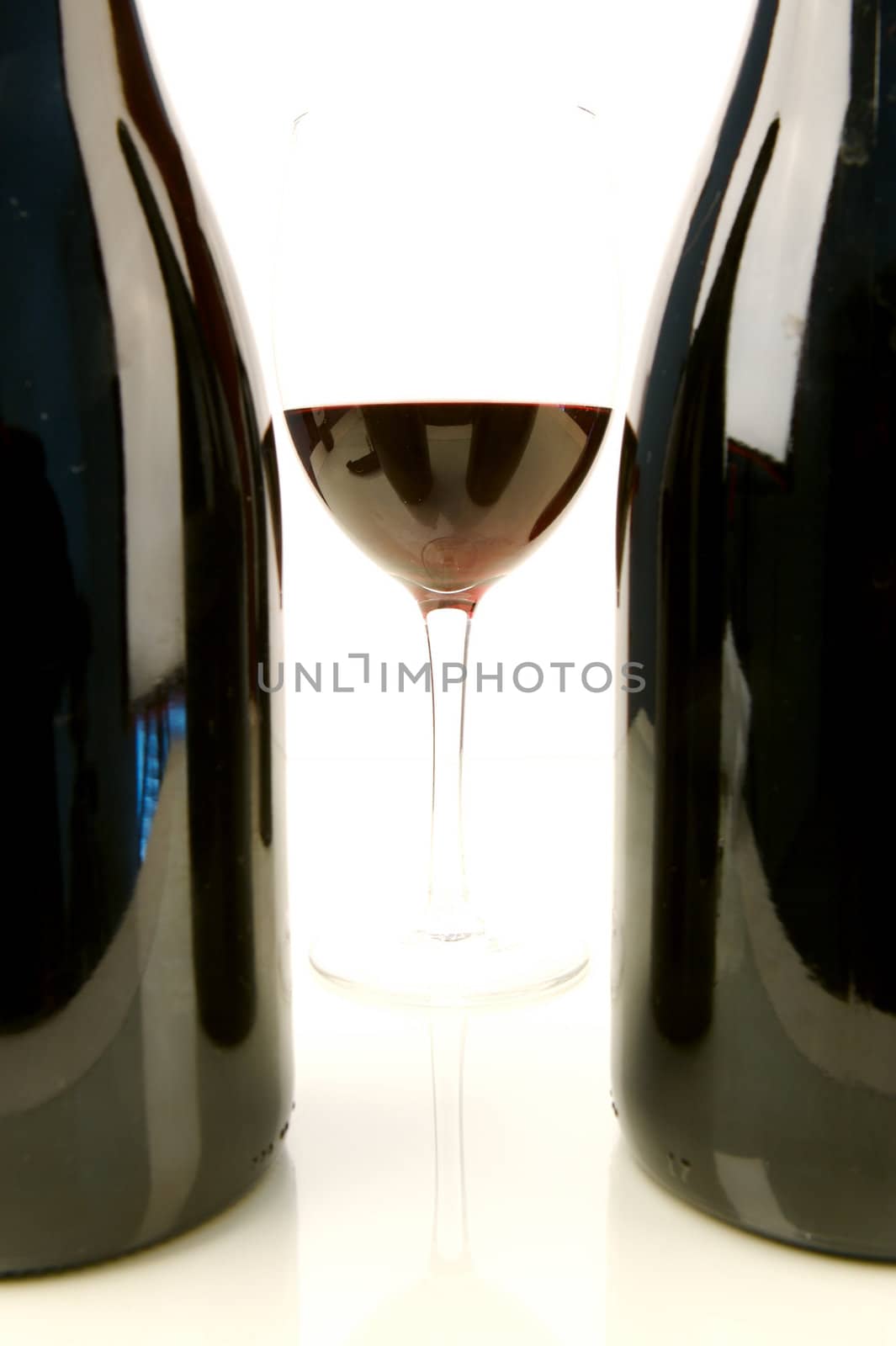 Red and white wine isolated against a white background