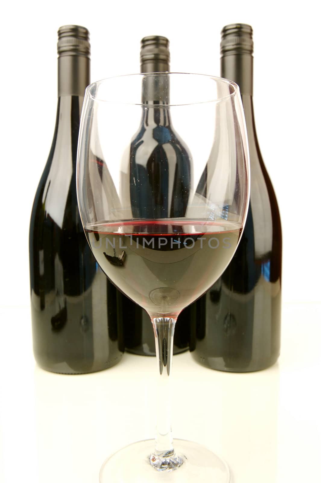Red and white wine isolated against a white background