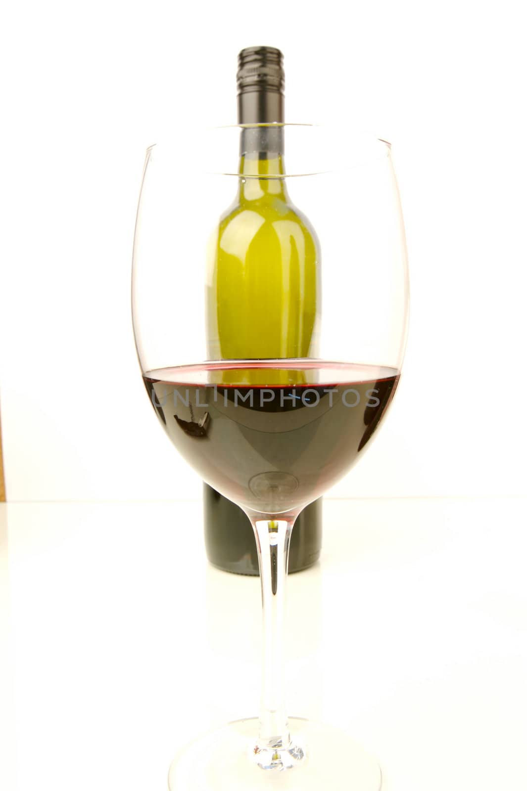 Red and white wine isolated against a white background