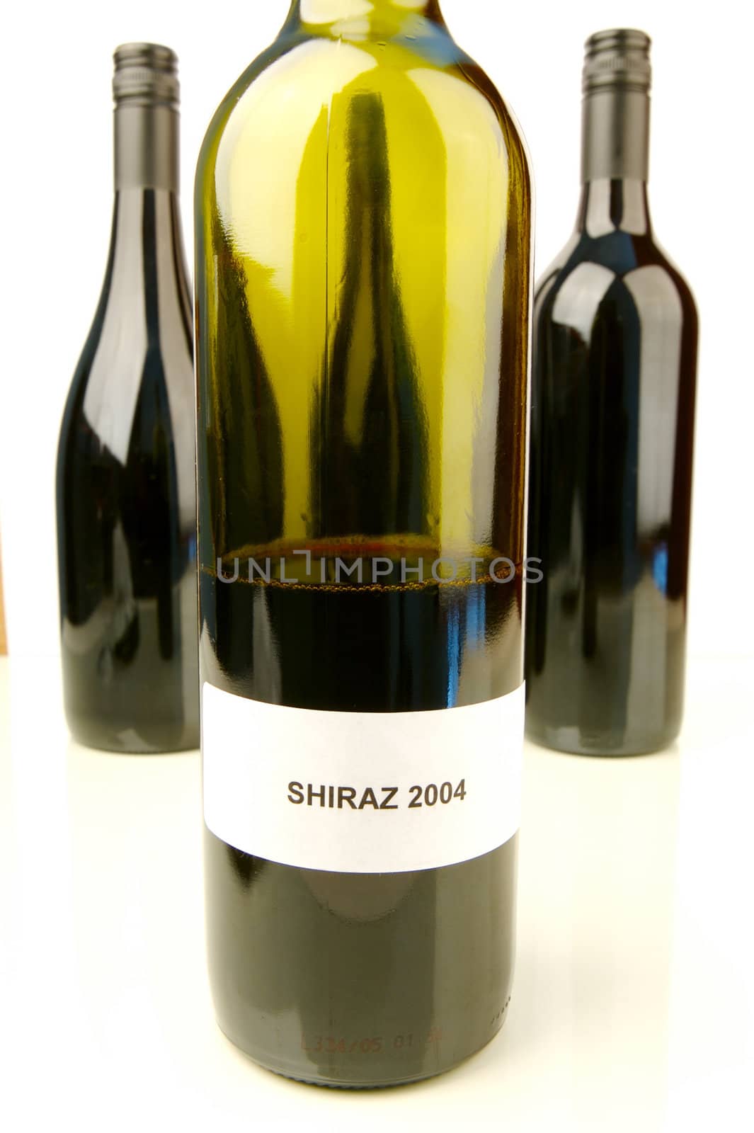 Red and white wine isolated against a white background