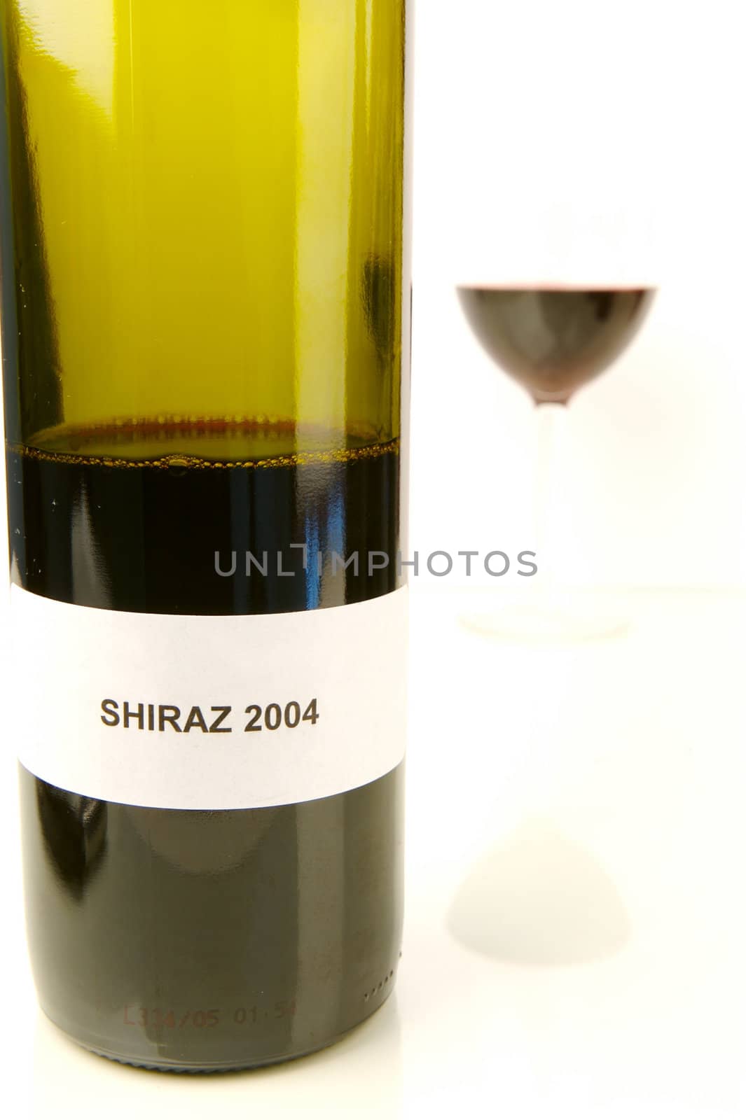 Red and white wine isolated against a white background