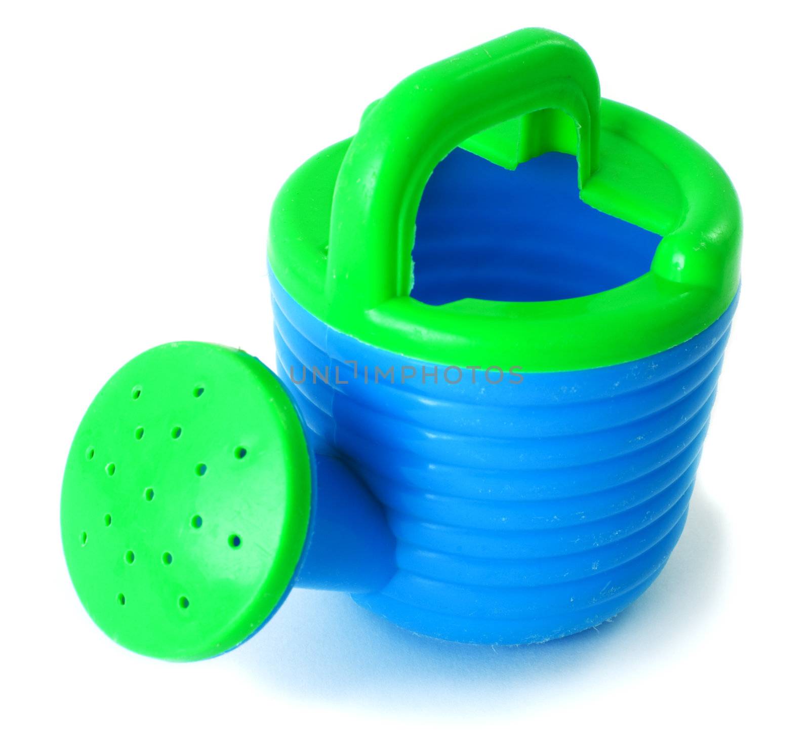 Toy blue plastic watering-can on the white background