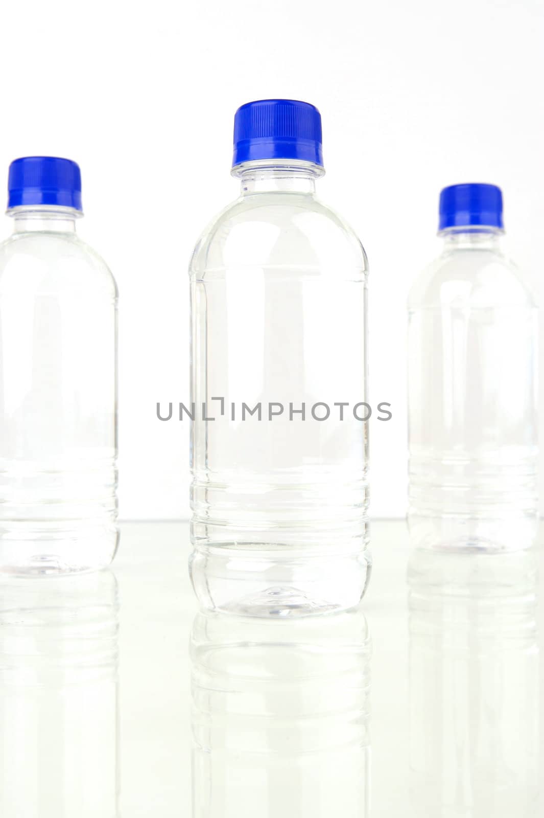 Bottled water isolated against various backgrounds