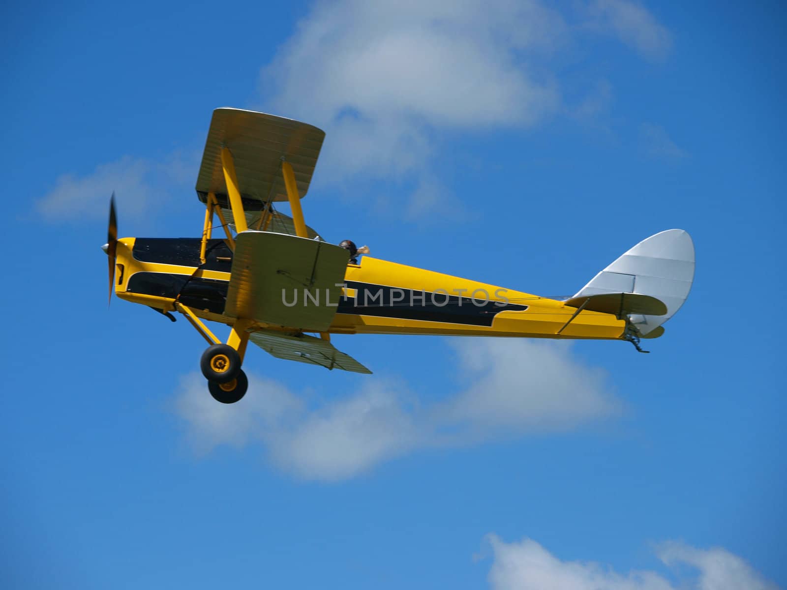 Yellow Vintage Aircraft against the sky