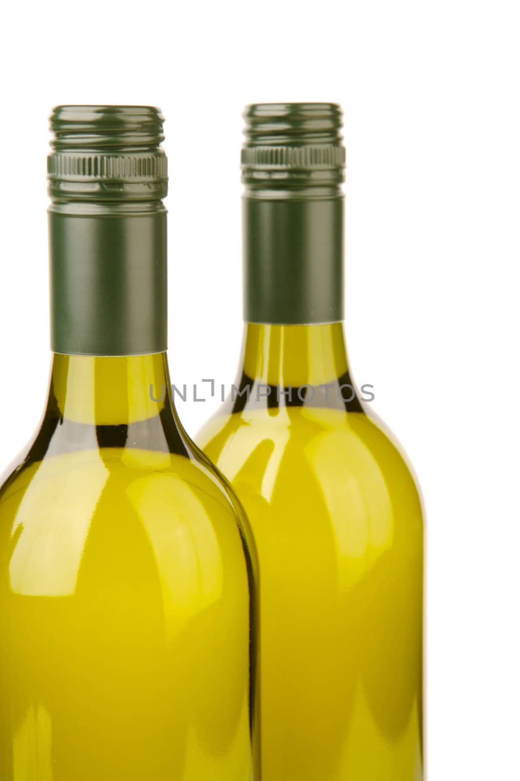 White wine bottles isolated against a white background