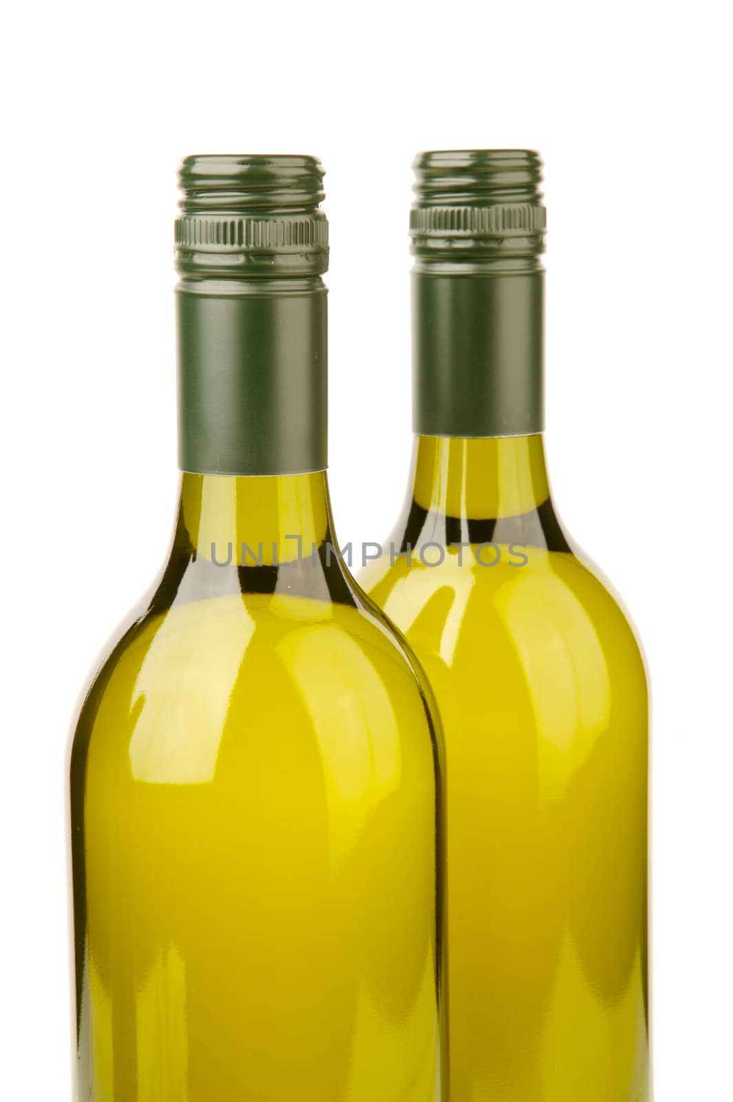 White wine bottles isolated against a white background