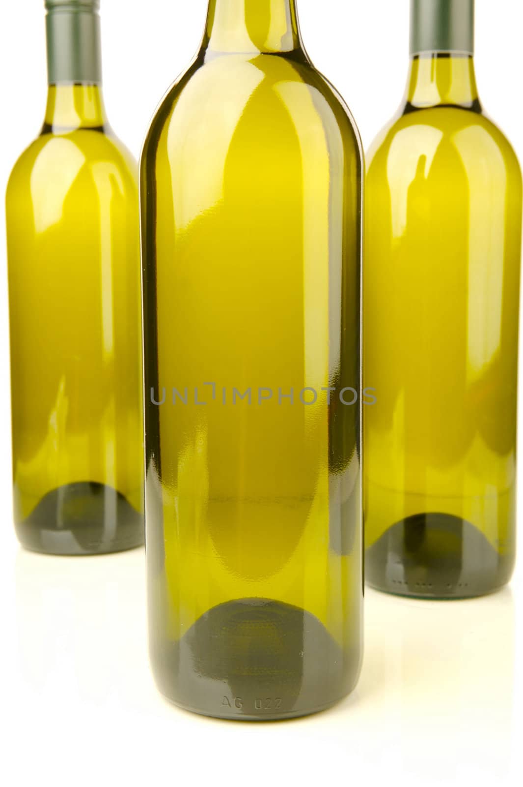 White wine bottles isolated against a white background