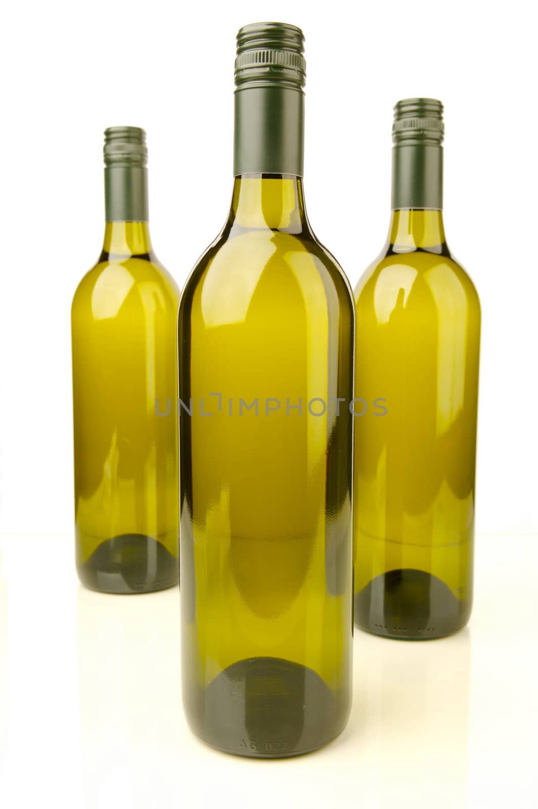 White wine bottles isolated against a white background