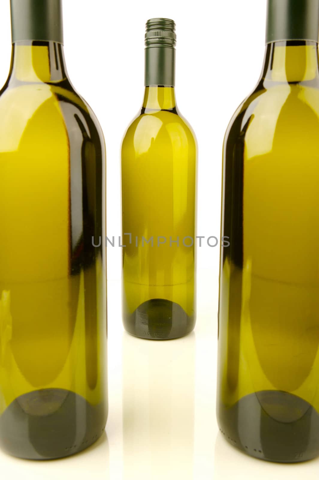 White wine bottles isolated against a white background