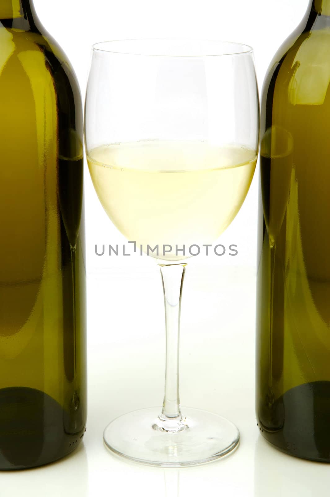 White wine bottles isolated against a white background